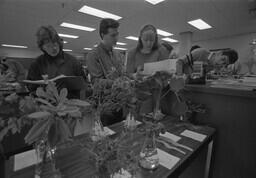 Biology students with plants.