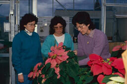agriculture – Norma Senn with students in greenhouse