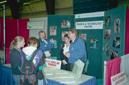 Career fair. Trades director Harv McCullough is in the booth on the right side. Randy Kelley is on left. Karen Power in the middle.